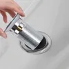 A hand is inserting a silver drain fitting into a sink drain. Podgląd zdjęcia produktu