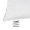A close-up of a white pillow with a label attached. Produktbild-Vorschau