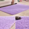 A collage of images showing a fluffy purple rug from different angles, including a close-up of its texture. Náhled obrázku produktu