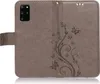 A grey flip case for a Samsung Galaxy S20 Plus phone, with a floral and butterfly embossed design. Produktbild-Vorschau