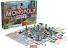 A Monopoly City board game set with the box and game board displayed. Produktbild-Vorschau