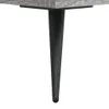 A close-up of a table leg attached to a tabletop. Produktbild-Vorschau