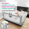 A mother and baby are on a bed with a baby bed rail. Produktbild-Vorschau