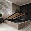 A bedroom with a bed frame that has its storage compartment open, revealing the slatted base. Produktbild-Vorschau