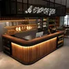 A modern bar counter with wooden panels and integrated lighting, stocked with bottles and bread. Voir les images du produit