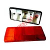 A disassembled car tail light assembly, showing the red lens and the reflective backing component separately against a white background. Voir les images du produit