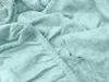 A close-up view of a mint-colored fitted sheet, showing the texture of the fabric and the elasticized edge. Náhled obrázku produktu