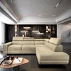 A modern living room with a large sectional sofa. Produktbild-Vorschau