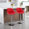 Two red bar stools are placed in front of a kitchen counter. Produktbild-Vorschau