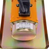 A close-up view of the top of a concrete vibrator motor, showing a label with product specifications. Náhled obrázku produktu