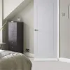 A bedroom scene with a dresser and a door. Náhled obrázku produktu