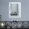 A modern bathroom mirror with integrated LED lighting, displayed on a wall with decorative items on a shelf behind it. Below the mirror are icons and text describing its features. Produktbild-Vorschau