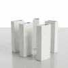 A set of five white ceramic vases arranged on a light gray surface against a white background. Produktbild-Vorschau