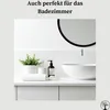 A clean and modern bathroom vanity with a sink, mirror, plant, and soap dispenser. Anteprima dell’immagine prodotto