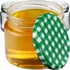 Three glass jars filled with honey, one in the foreground with a green and white checkered lid. Anteprima dell’immagine prodotto