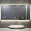 A modern bathroom with a smart mirror above a sink. Produktbild-Vorschau