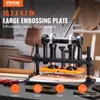 A leather embossing machine is shown in a workshop setting, with various materials and tools around it. Produktbild-Vorschau