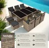An outdoor rattan seating group with a table and chairs is set up next to a swimming pool. Náhled obrázku produktu