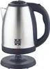 A stainless steel electric kettle with a black handle and base, shown with its power base. Voir les images du produit