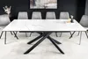 A dining table with chairs in a modern dining room setting. Produktbild-Vorschau