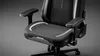 A close-up, studio shot of a black gaming chair with white and gray accents. Anteprima dell’immagine prodotto