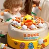 A child and an adult are playing with a duck-themed interactive game. Náhľad obrázku produktu