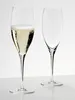 Two champagne flutes on a reflective surface against a white background. One flute is filled with champagne, the other is empty. Produktbild-Vorschau