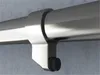A close-up view of a metal pipe attached to a concrete wall with a bracket. Náhled obrázku produktu
