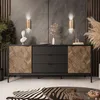 A modern living room setting featuring a black sideboard with wood-paneled doors, decorative wall sconces, and a zebra-print rug. Produktbild-Vorschau