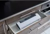 A white vacuum sealer machine is placed in an open kitchen drawer. Anteprima dell’immagine prodotto