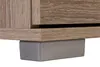 A close-up view of the bottom of a wooden cabinet with a gray leg cover. Produktbild-Vorschau