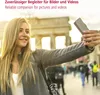 A young woman takes a selfie with a smartphone in front of the Brandenburg Gate in Berlin. Voir les images du produit