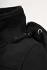 A close-up detail of a black fleece jacket's collar and zipper. Produktbild-Vorschau