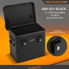 A black aluminum storage box with its lid open, displayed against an orange and dark gray background. A close-up inset shows the lock mechanism. Produktbild-Vorschau