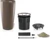 A collection of components for a planter, including the planter itself, an inner pot, a drainage insert, a water level indicator, and gravel. Produktbild-Vorschau