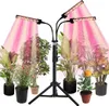 A plant grow light with multiple adjustable heads is shown illuminating several potted plants. Produktbild-Vorschau