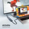 A laptop connected to a large monitor via a USB-C hub, displaying a video editing interface. Produktbild-Vorschau