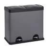 A gray dual-compartment trash can with black lids and pedals, shown against a white background. Voir les images du produit