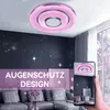 A modern living room with a pink LED ceiling light and a sofa. Produktbild-Vorschau