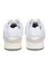 A pair of white Champion sneakers shown from the back. Produktbild-Vorschau
