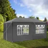 A dark gray party tent is set up on a green lawn with trees and a blue sky in the background. Náhled obrázku produktu