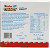 The image shows the back of a Kinder Creamy, Milky & Crunchy product box, displaying nutritional information and ingredients. Voir les images du produit