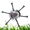 A metal trimmer head with wire bristles is shown against a white background with a foreground of green grass. Produktbild-Vorschau