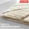 A close-up of a textured beige bath mat with a leaf pattern. Anteprima dell’immagine prodotto