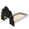 A bed frame with a cloud-shaped headboard, shown from a diagonal angle against a white background. Voir les images du produit