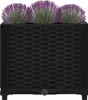A black planter box with purple and green artificial plants on a white background. Náhľad obrázku produktu