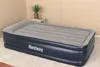An inflatable air mattress with the brand name 'Bestway' visible on the side, placed on a carpeted floor in a room with neutral walls. Náhled obrázku produktu