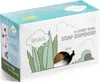 The image shows the packaging of a snail-shaped soap dispenser, with illustrations of grass, clouds, and a snail. Voir les images du produit