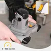 Hands holding a gray and black electric mixer with a yellow speed dial highlighted. Náhled obrázku produktu