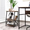 A small side table with books and a plant next to a desk. Náhľad obrázku produktu